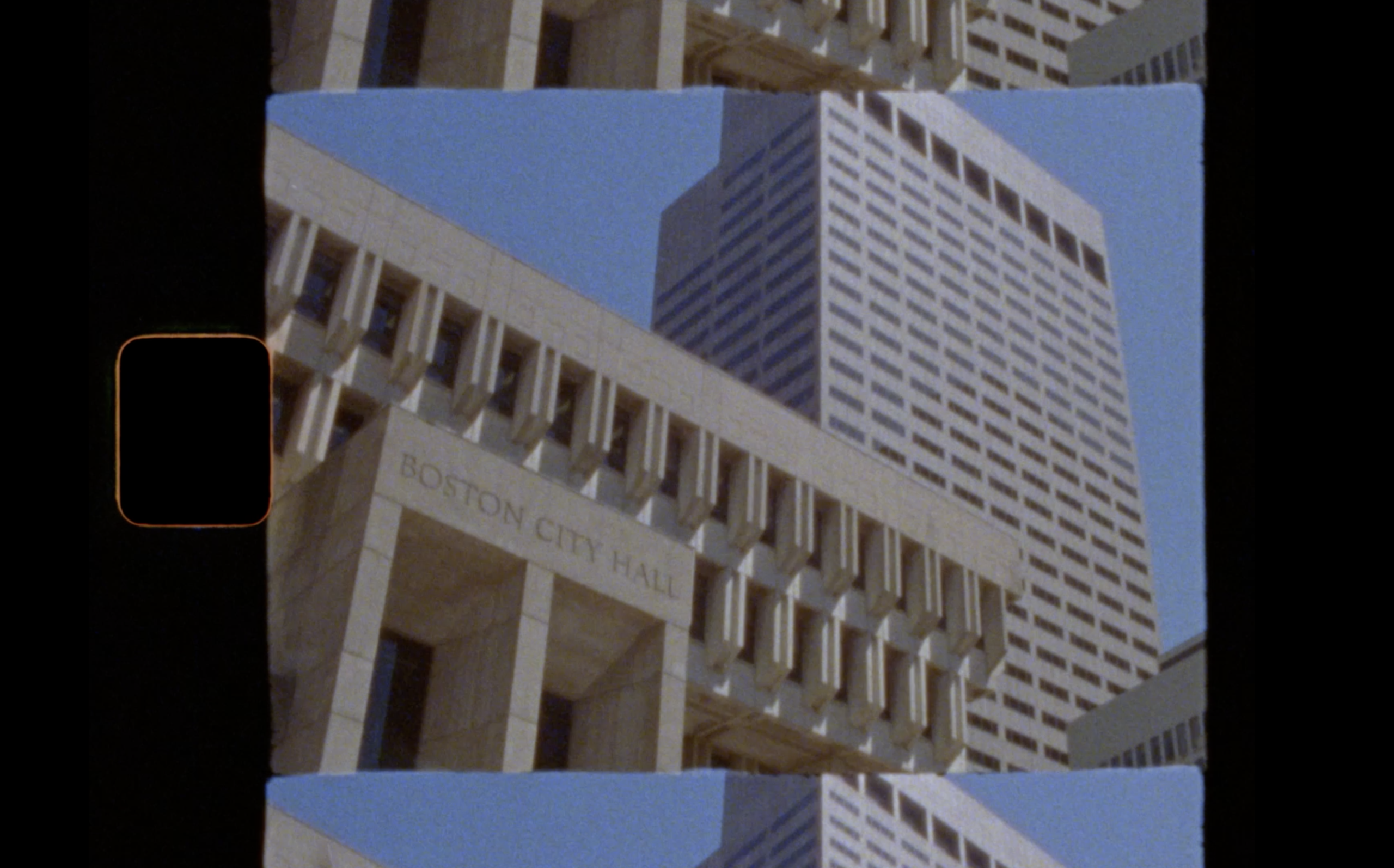 Boston City Hall’s facade with its name visible, alongside a modern high-rise building in the background, both under a clear blue sky. The image appears to be from a film strip, with visible frame edges.